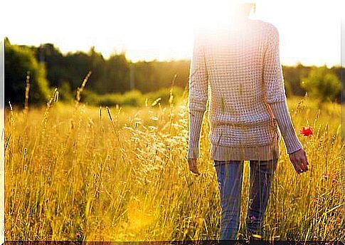 Woman walking in a field.