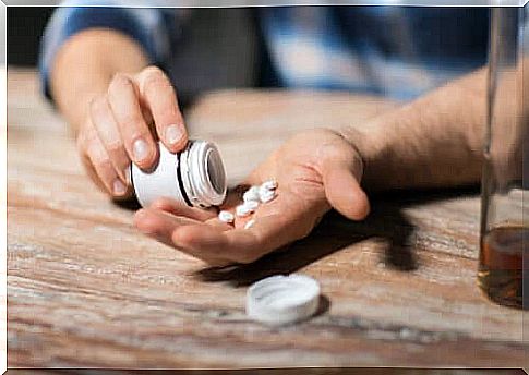 Person emptying pills out of a jar