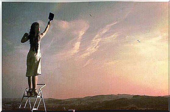 Woman paints sky