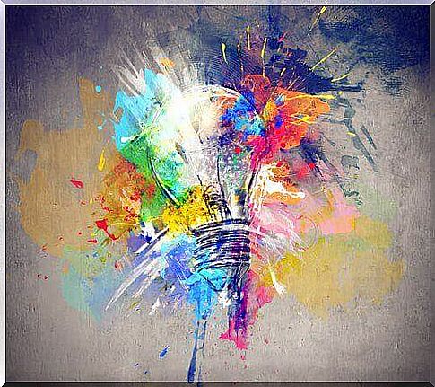 A light bulb surrounded by colors that represent an impulse of creativity after undergoing brain stimulation