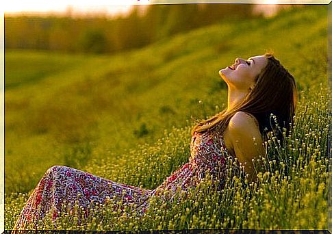 Happy woman on meadow