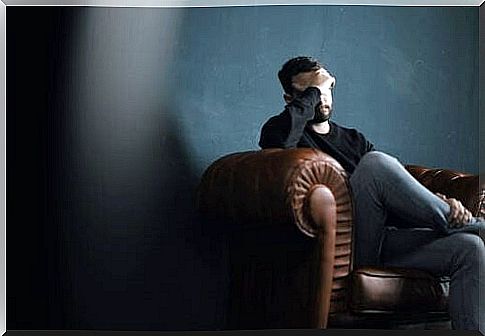 Man with sleep problems sitting on sofa