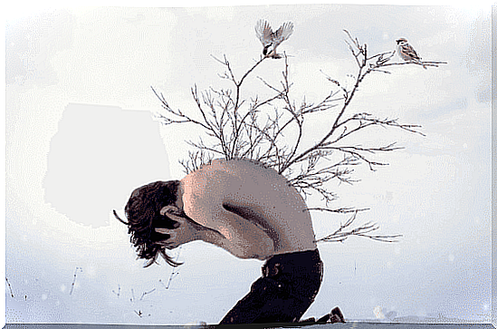 Boy with branches on his back