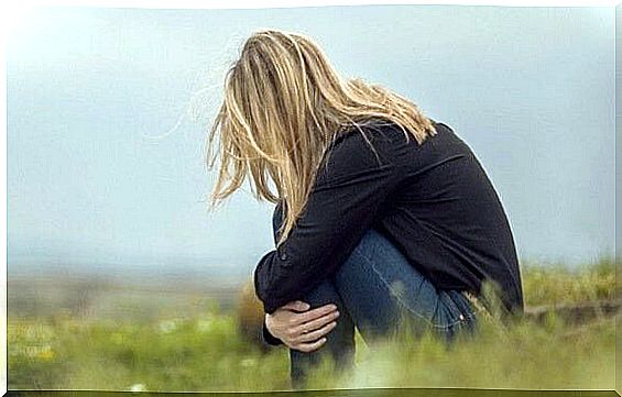 Woman sitting on the field