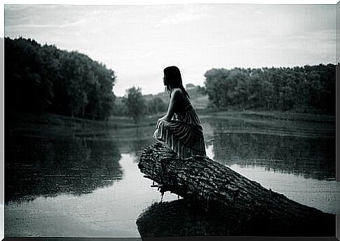 Woman by river